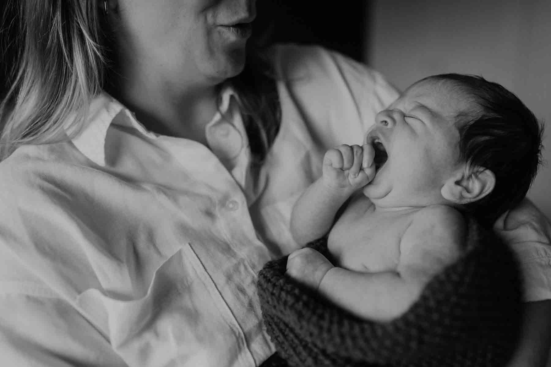 new born baby shooting indoors baby jawning
